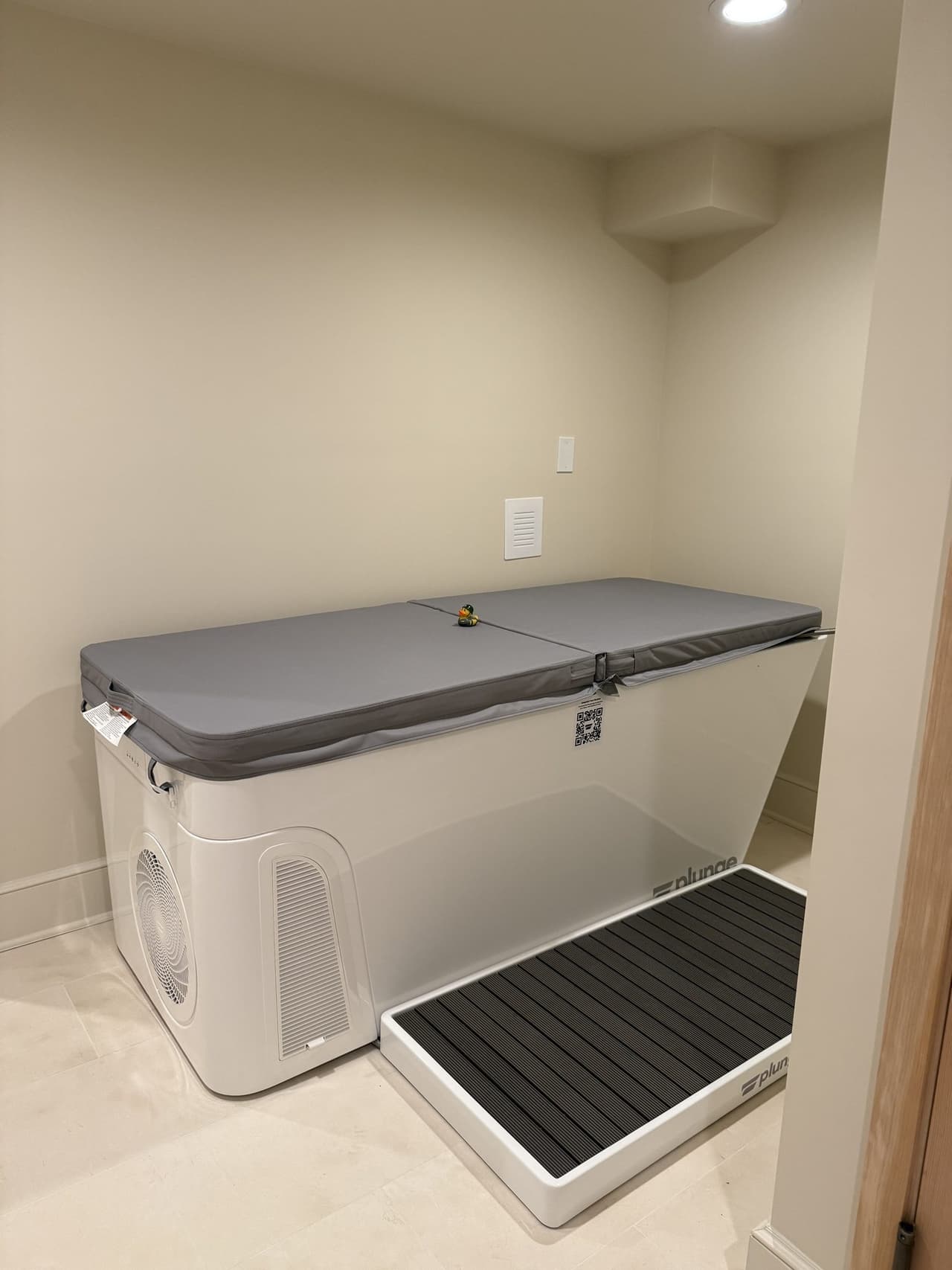 Cold plunge tub set into a tiled alcove in a Short Hills, NJ basement spa by Michael Robert Construction