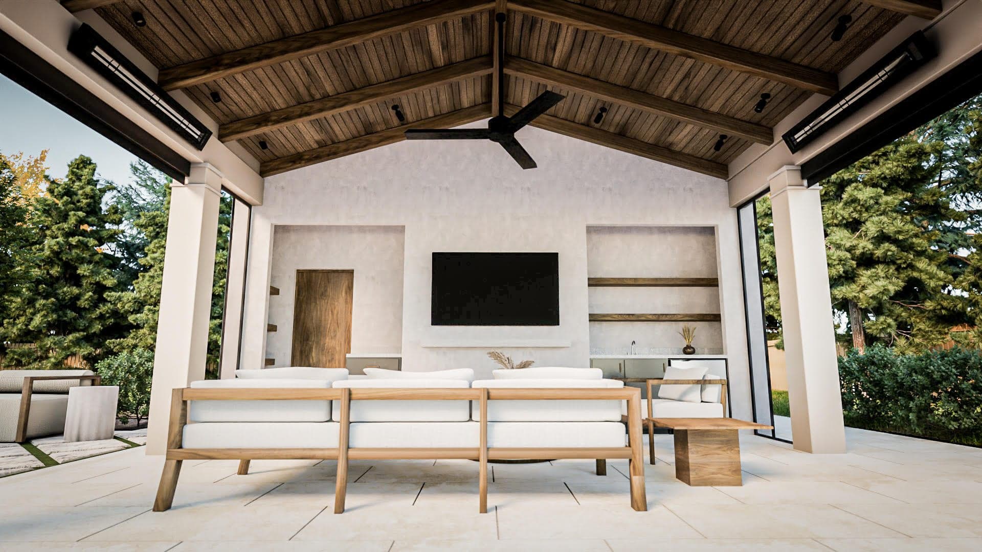 Covered outdoor room with a planked ceiling, a ceiling fan and a long table facing the garden