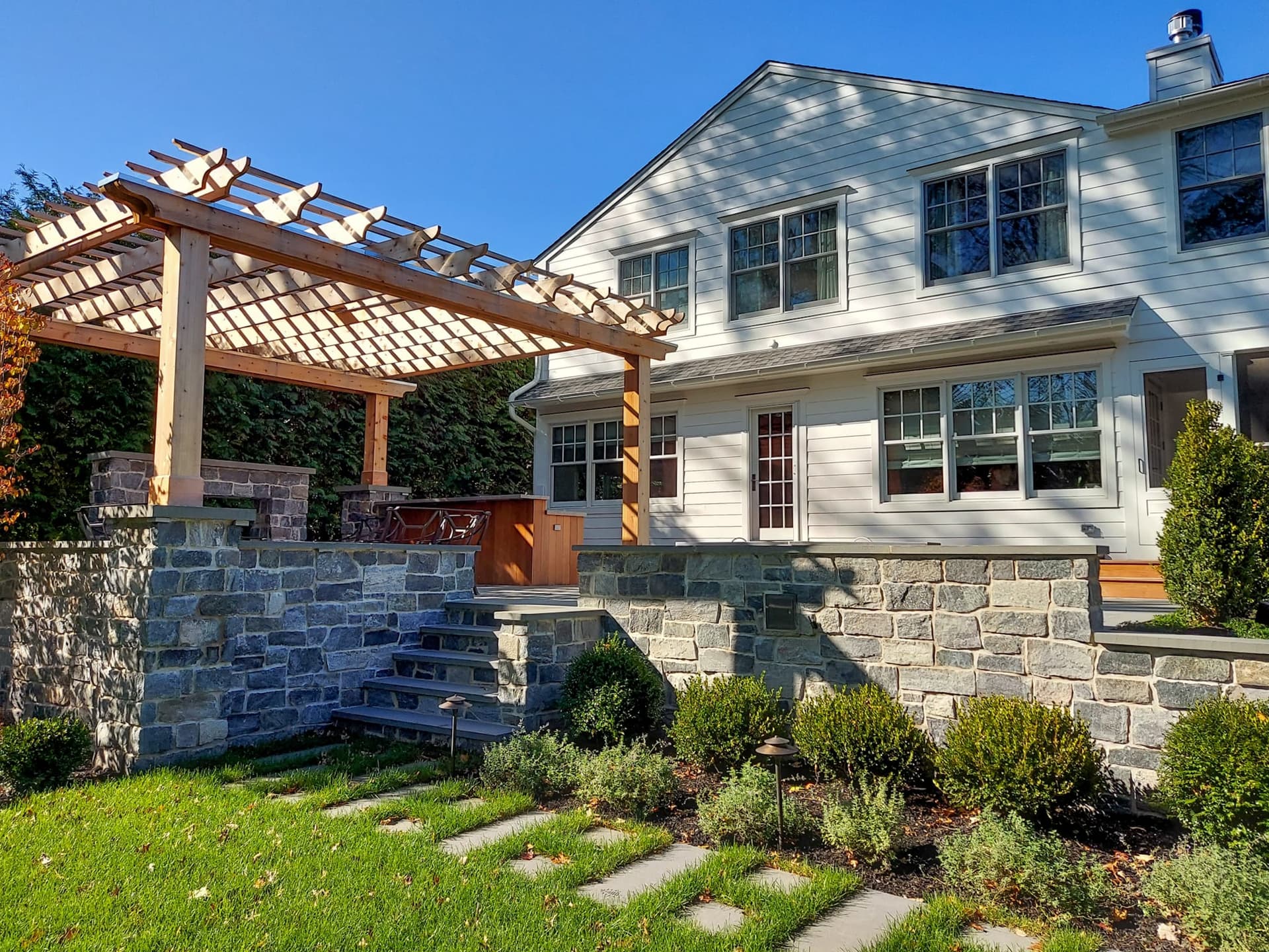Pool, patio and lawn of a whole-home renovation and addition in Westfield, NJ, by Michael Robert Construction
