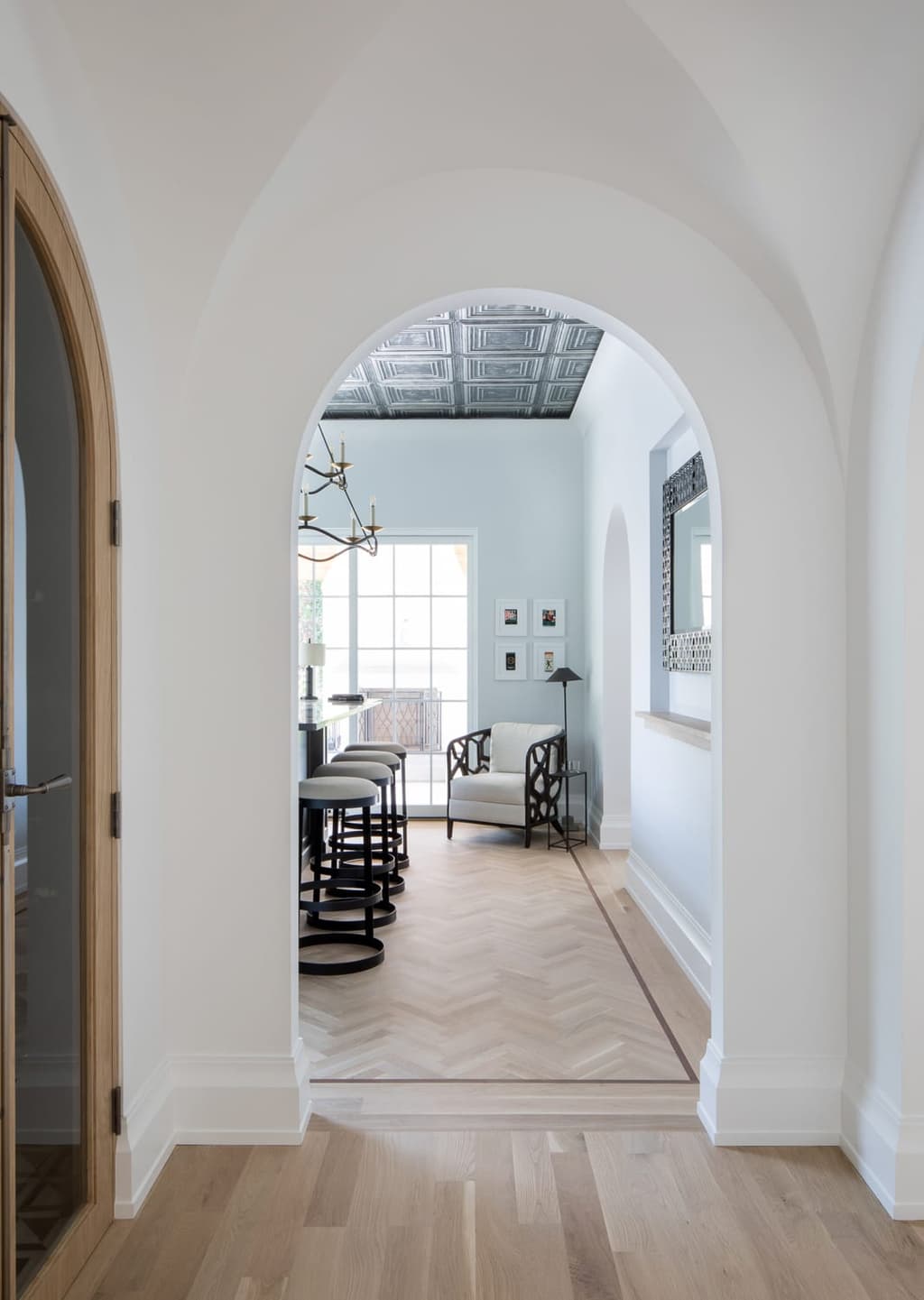 Hall into bar in a custom new construction home in Westfield, NJ