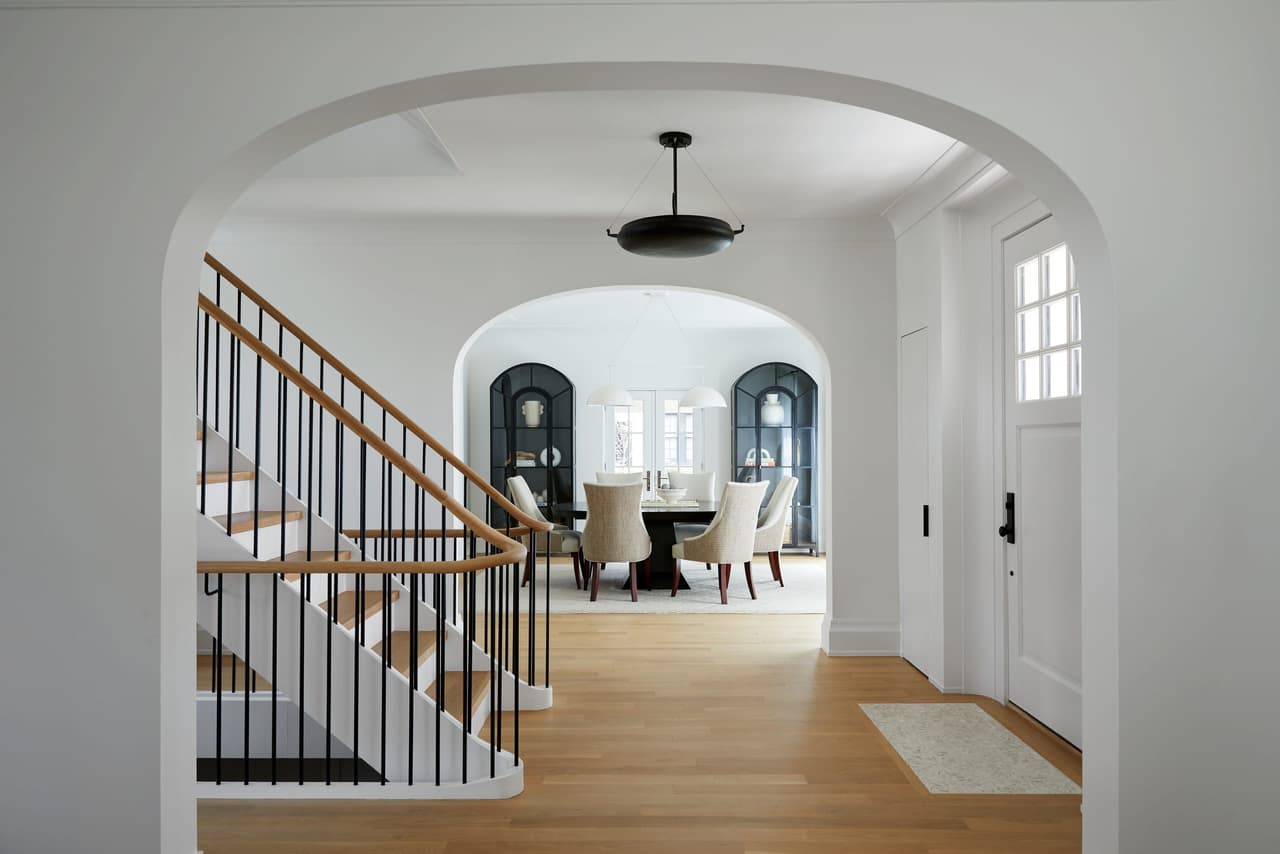 Arched opening to the stair hall, looking through to the dining room