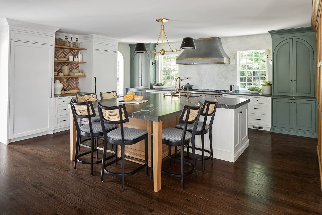 Open shelving, a plaster range hood and a pale green island in the kitchen of a Westfield, NJ home renovation, by Michael Robert Construction