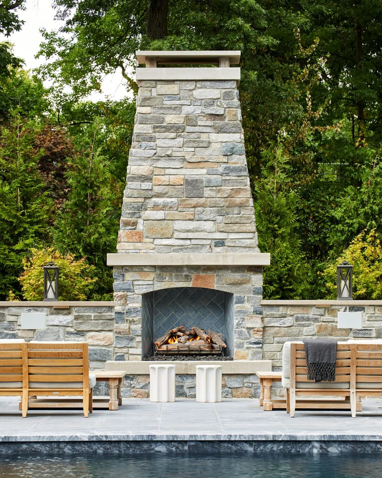 Close-up of the dry-laid stone outdoor fireplace in a Westfield, NJ backyard built by Michael Robert Construction