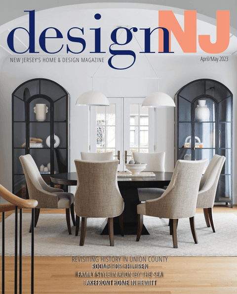 April/May 2023 cover of Design NJ, a dining room with arched glass cabinets under dome pendants, from its coverage of Michael Robert Construction