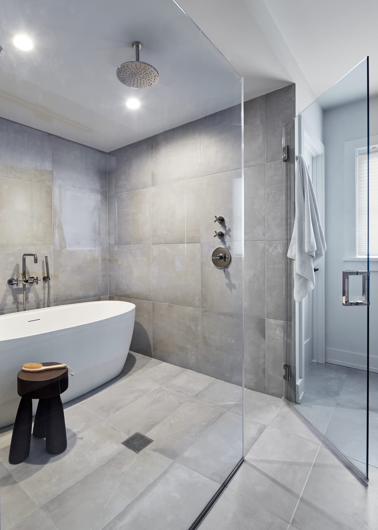 Wet room in a Westfield, NJ primary bathroom, with a freestanding tub and a rain shower sharing one large-format tiled enclosure, built by Michael Robert Construction