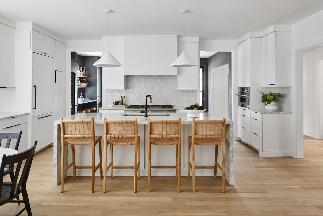 White modern kitchen with custom hood and cabinets in Westfield NJ home renovation