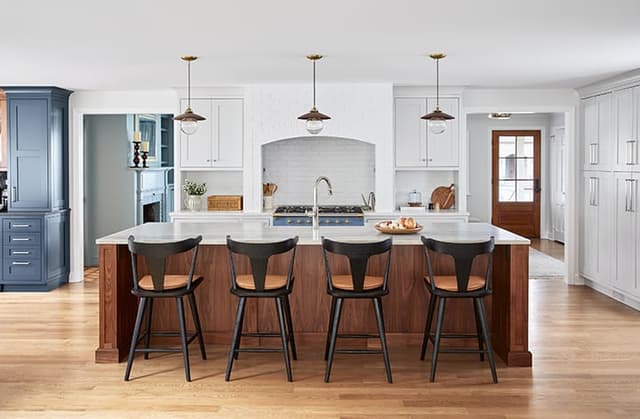 Kitchen in walnut and white with custom brick hood in Westfield NJ home with modern farmhouse style