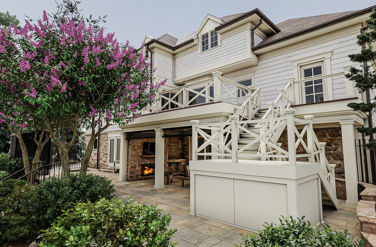 Architectural rendering of a covered patio at a Mountainside, NJ home renovation, with an outdoor fireplace in the stone base and a lattice railing above