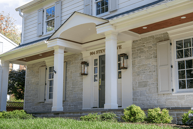 Side view along the porch of a Westfield, NJ exterior renovation, showing the cedar soffit, the columns and the pedimented entry