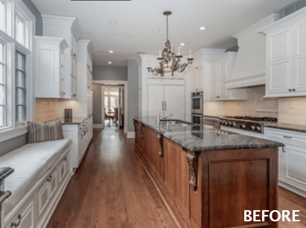 Before photograph of the kitchen in a historic Westfield, NJ home, with a dark granite island, cherry cabinets and a chandelier, labeled Before in the corner